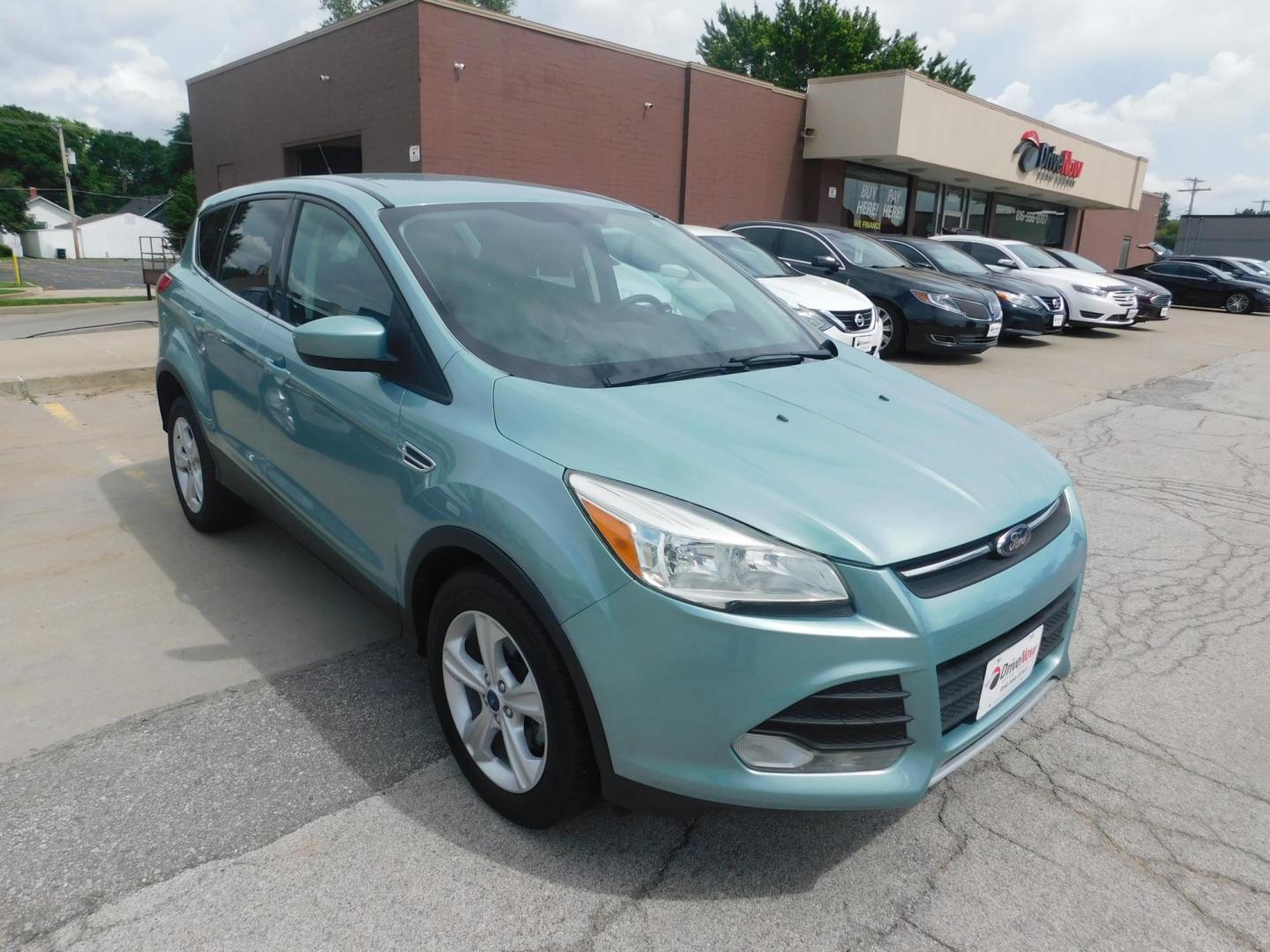 2013 GREEN Ford Escape SE FWD (1FMCU0GX9DU) with an 1.6L L4 DOHC 16V engine, 6-Speed Automatic transmission, located at 2121 Burlington St, North Kansas City, MO, 64116, (816) 556-0707, 39.144707, -94.581978 - Photo#8