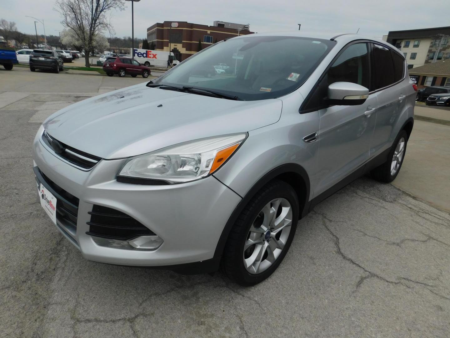 2013 SILVER Ford Escape SEL FWD (1FMCU0HX3DU) with an 1.6L L4 DOHC 16V engine, 6-Speed Automatic transmission, located at 2121 Burlington St, North Kansas City, MO, 64116, (816) 556-0707, 39.144707, -94.581978 - Photo#0