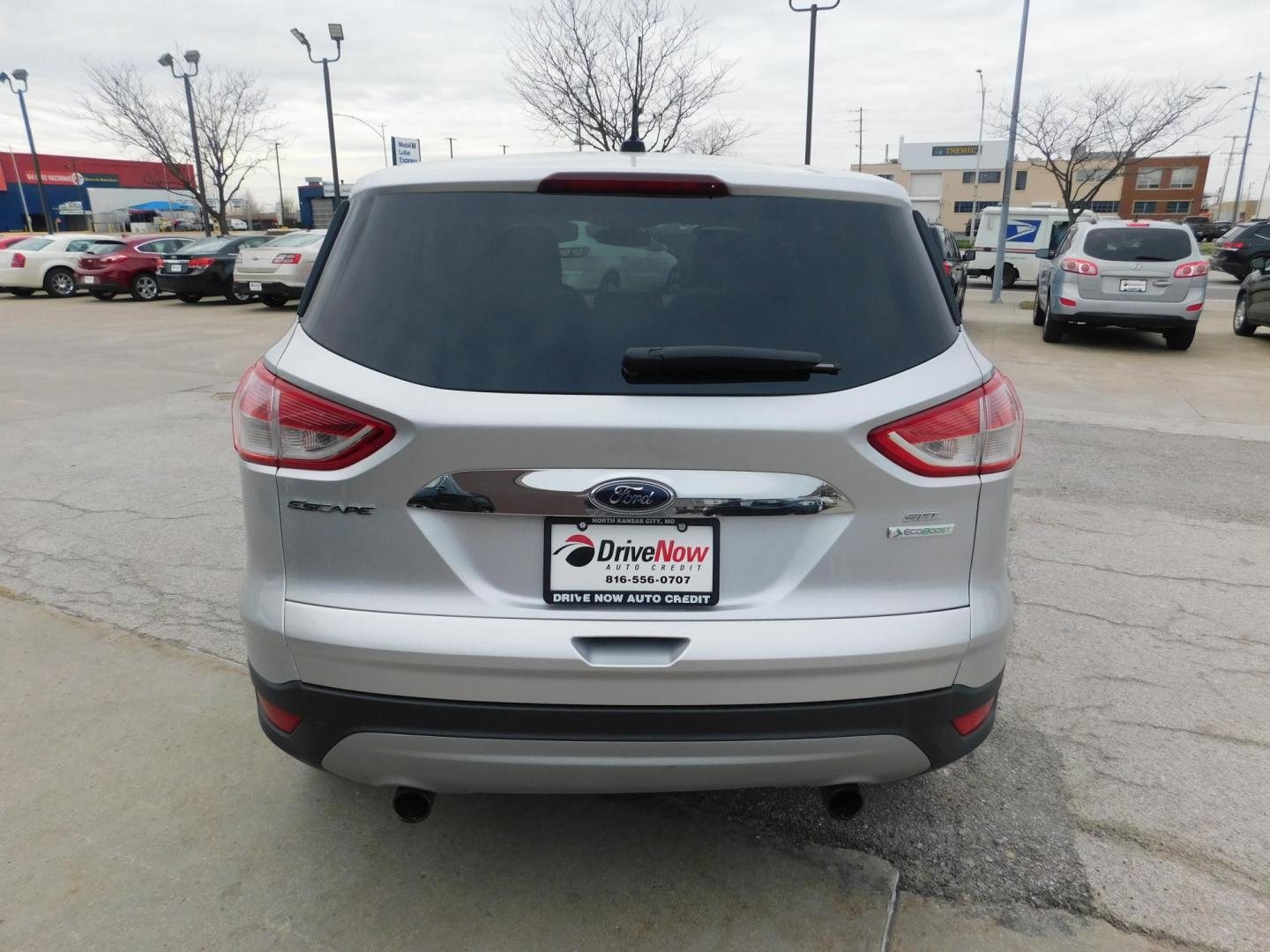 2013 SILVER Ford Escape SEL FWD (1FMCU0HX3DU) with an 1.6L L4 DOHC 16V engine, 6-Speed Automatic transmission, located at 2121 Burlington St, North Kansas City, MO, 64116, (816) 556-0707, 39.144707, -94.581978 - Photo#7