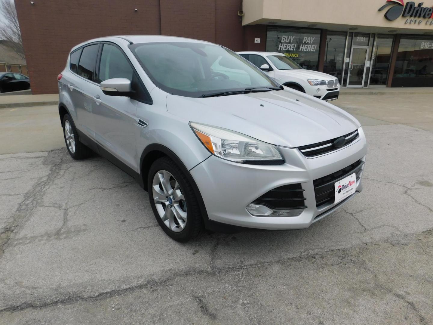 2013 SILVER Ford Escape SEL FWD (1FMCU0HX3DU) with an 1.6L L4 DOHC 16V engine, 6-Speed Automatic transmission, located at 2121 Burlington St, North Kansas City, MO, 64116, (816) 556-0707, 39.144707, -94.581978 - Photo#8