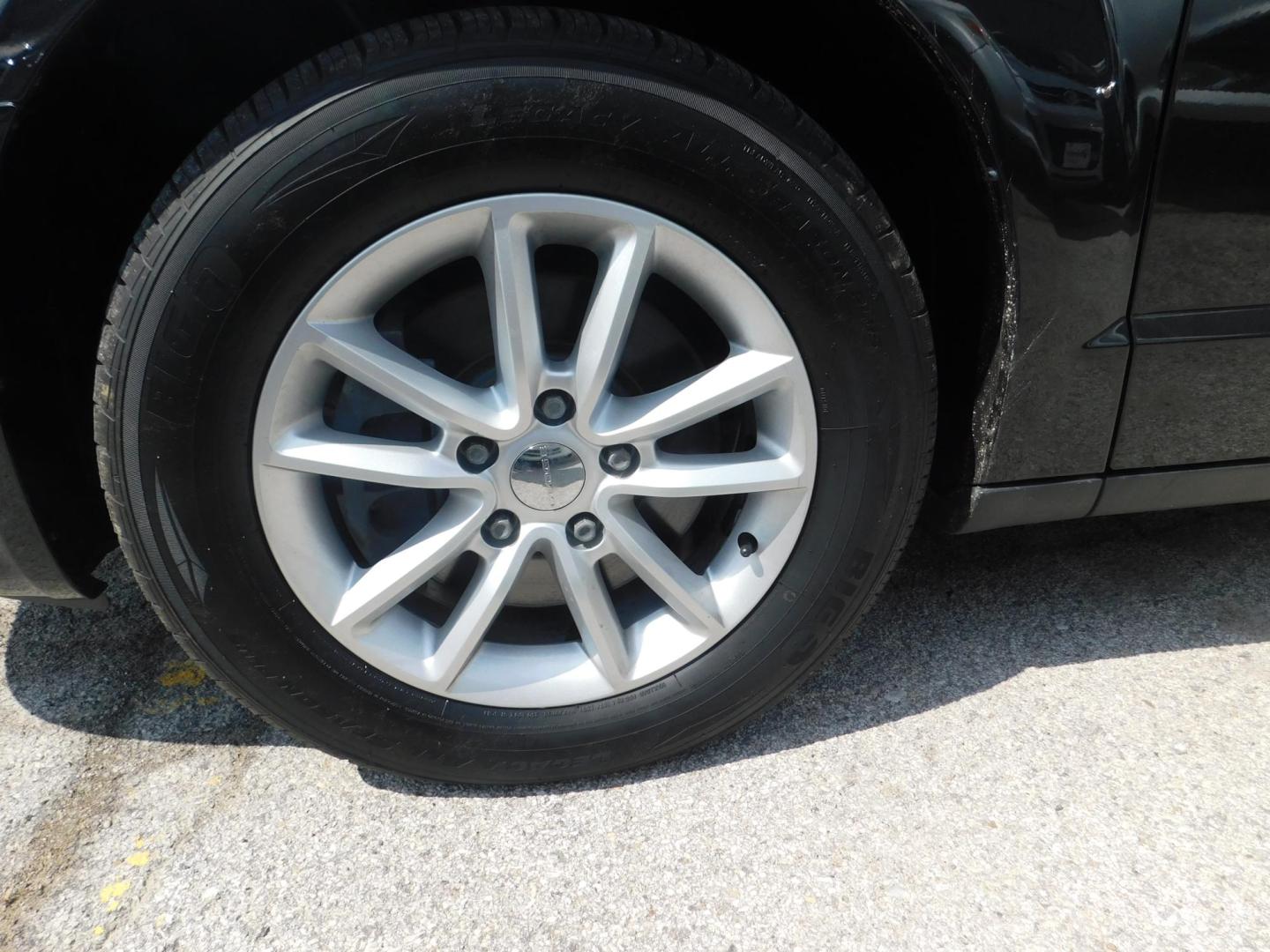 2018 BLACK Dodge Grand Caravan SXT (2C4RDGCG2JR) with an 3.6L V6 DOHC 24V engine, 6A transmission, located at 2121 Burlington St, North Kansas City, MO, 64116, (816) 556-0707, 39.144707, -94.581978 - Photo#1