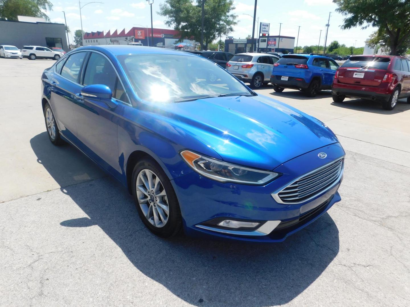 2017 BLUE Ford Fusion SE (3FA6P0HDXHR) with an 1.5L L4 DOHC 16V engine, 6A transmission, located at 2121 Burlington St, North Kansas City, MO, 64116, (816) 556-0707, 39.144707, -94.581978 - Photo#9