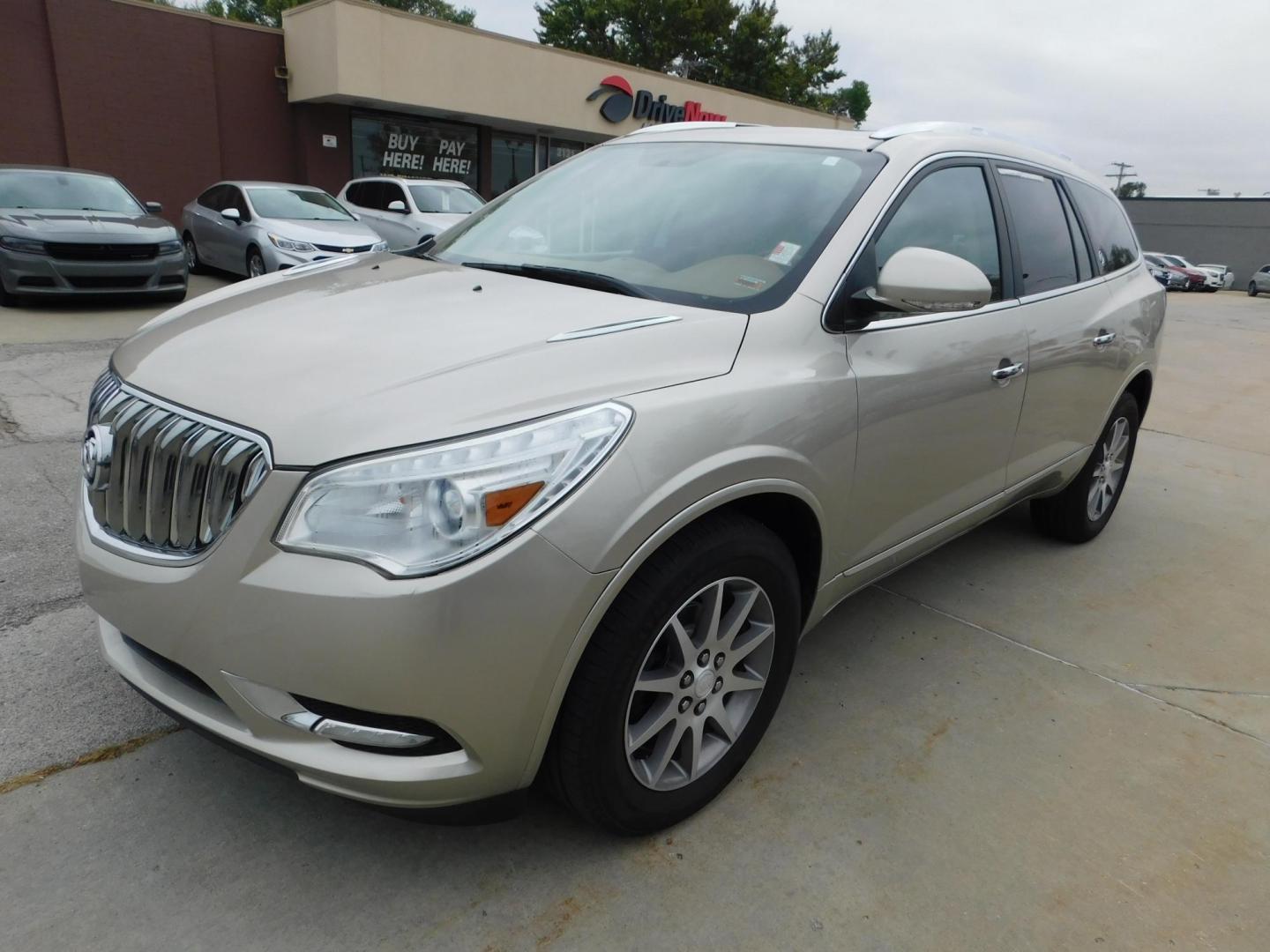 2014 TAN Buick Enclave Leather FWD (5GAKRBKDXEJ) with an 3.6L V6 DOHC 24V engine, 6-Speed Automatic Overdrive transmission, located at 2121 Burlington St, North Kansas City, MO, 64116, (816) 556-0707, 39.144707, -94.581978 - Photo#0