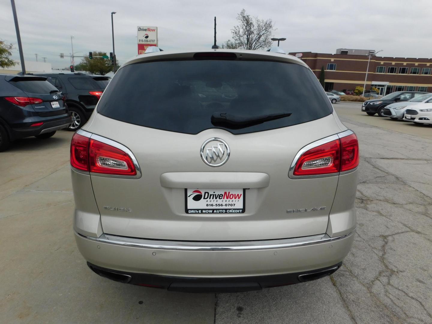 2014 TAN Buick Enclave Leather FWD (5GAKRBKDXEJ) with an 3.6L V6 DOHC 24V engine, 6-Speed Automatic Overdrive transmission, located at 2121 Burlington St, North Kansas City, MO, 64116, (816) 556-0707, 39.144707, -94.581978 - Photo#11