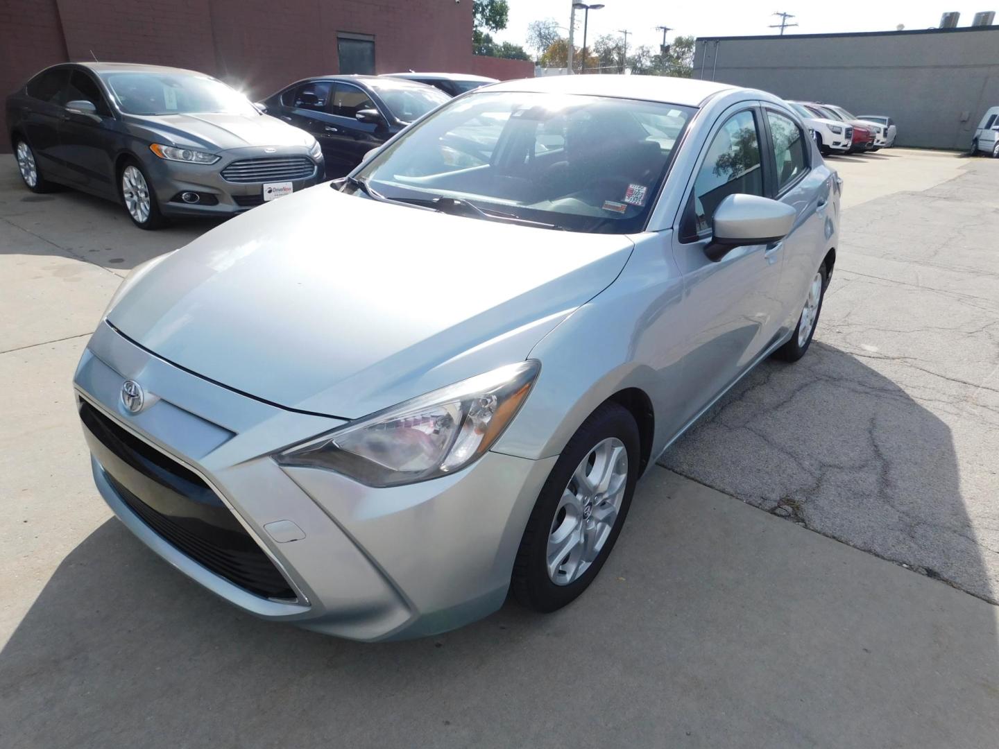 2018 GRAY Toyota Yaris iA 6A (3MYDLBYVXJY) with an 1.5L L4 DOHC 16V engine, 6A transmission, located at 2121 Burlington St, North Kansas City, MO, 64116, (816) 556-0707, 39.144707, -94.581978 - Photo#0
