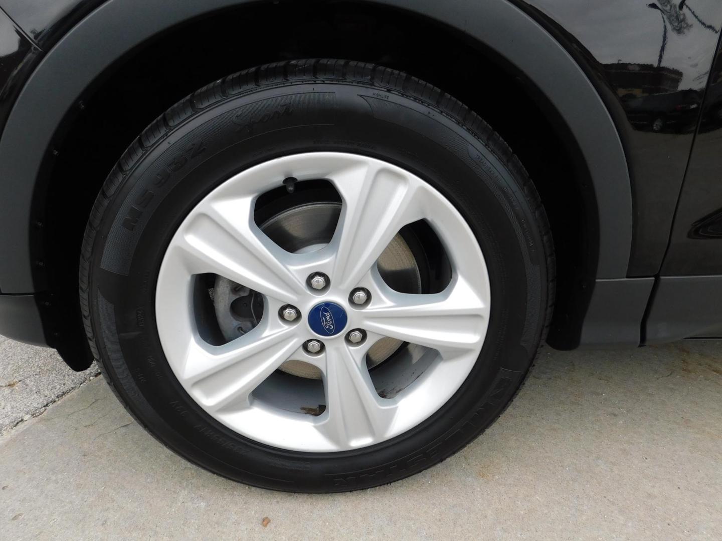 2016 BLACK Ford Escape SE FWD (1FMCU0G77GU) with an 2.5L L4 DOHC 16V engine, 6-Speed Automatic transmission, located at 2121 Burlington St, North Kansas City, MO, 64116, (816) 556-0707, 39.144707, -94.581978 - Photo#1