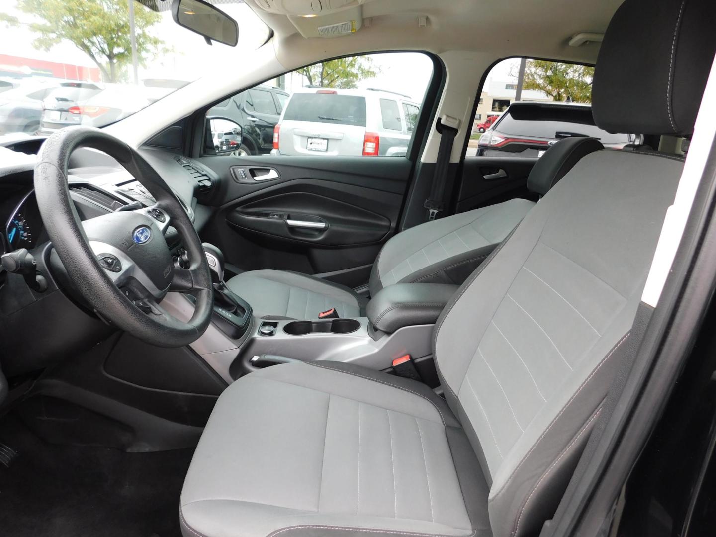 2016 BLACK Ford Escape SE FWD (1FMCU0G77GU) with an 2.5L L4 DOHC 16V engine, 6-Speed Automatic transmission, located at 2121 Burlington St, North Kansas City, MO, 64116, (816) 556-0707, 39.144707, -94.581978 - Photo#2