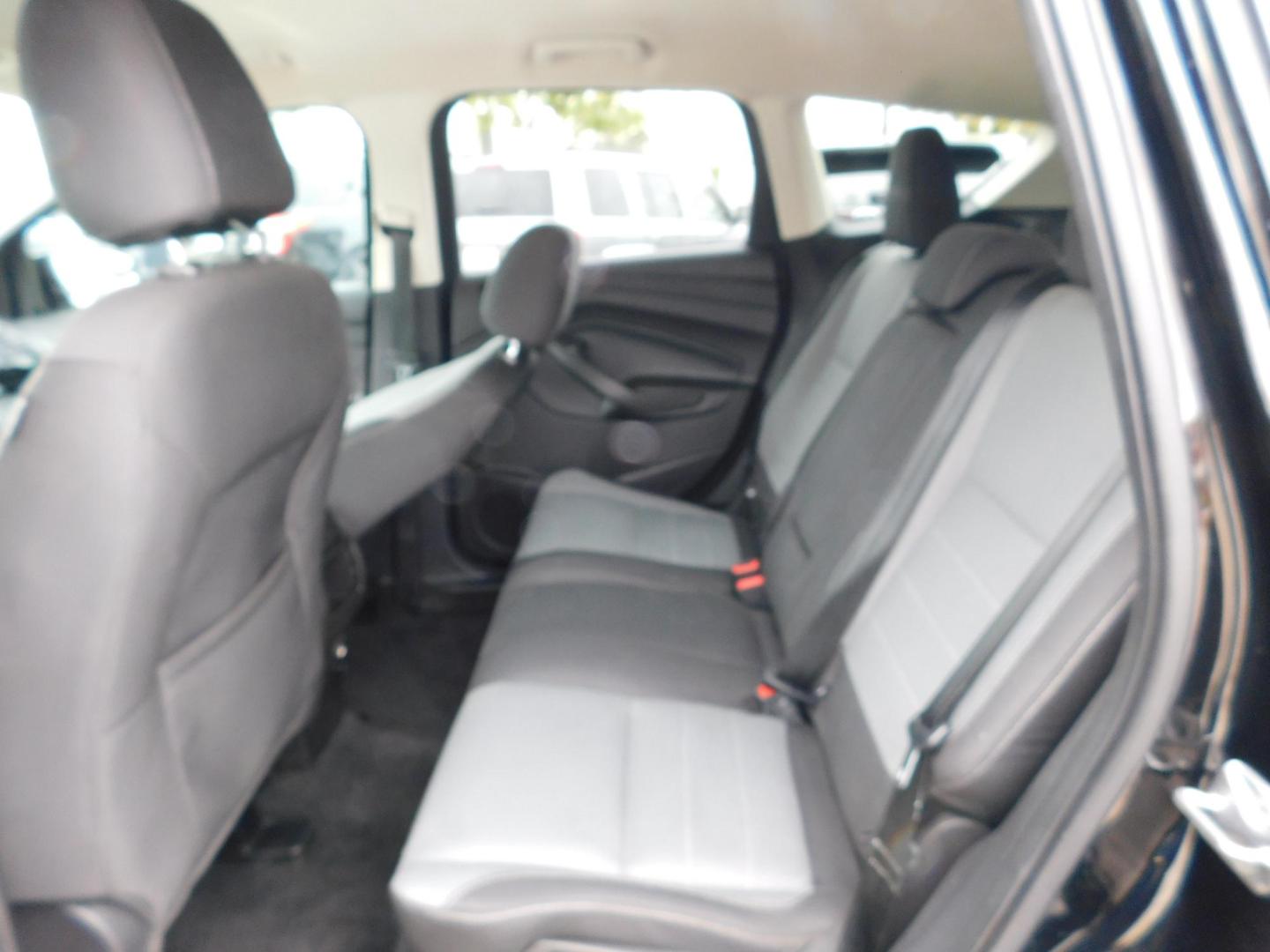 2016 BLACK Ford Escape SE FWD (1FMCU0G77GU) with an 2.5L L4 DOHC 16V engine, 6-Speed Automatic transmission, located at 2121 Burlington St, North Kansas City, MO, 64116, (816) 556-0707, 39.144707, -94.581978 - Photo#6