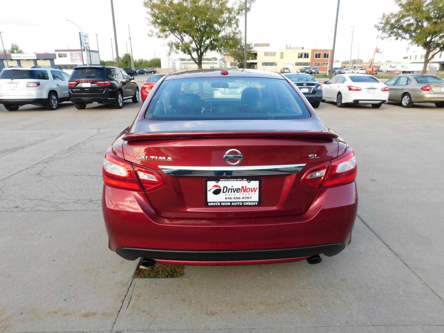 2016 RED Nissan Altima 2.5 SL (1N4AL3AP4GC) with an 2.5L L4 DOHC 16V engine, CVT transmission, located at 2121 Burlington St, North Kansas City, MO, 64116, (816) 556-0707, 39.144707, -94.581978 - Photo#9
