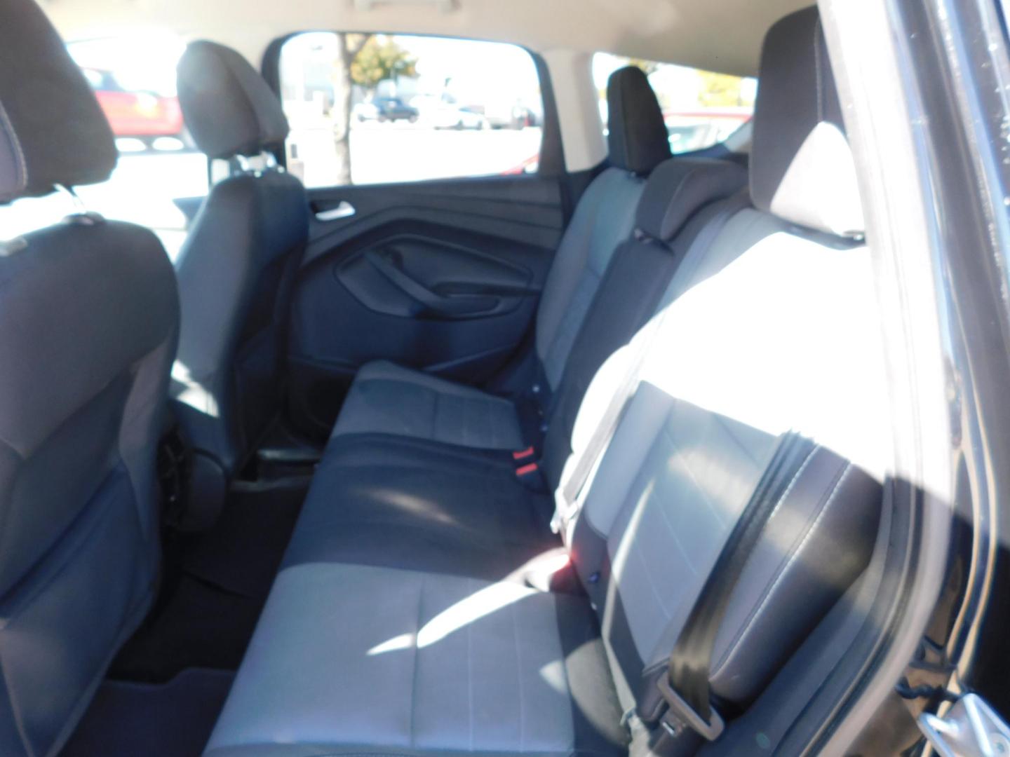 2016 BLACK Ford Escape SE FWD (1FMCU0GX2GU) with an 1.6L L4 DOHC 16V engine, 6-Speed Automatic transmission, located at 2121 Burlington St, North Kansas City, MO, 64116, (816) 556-0707, 39.144707, -94.581978 - Photo#6