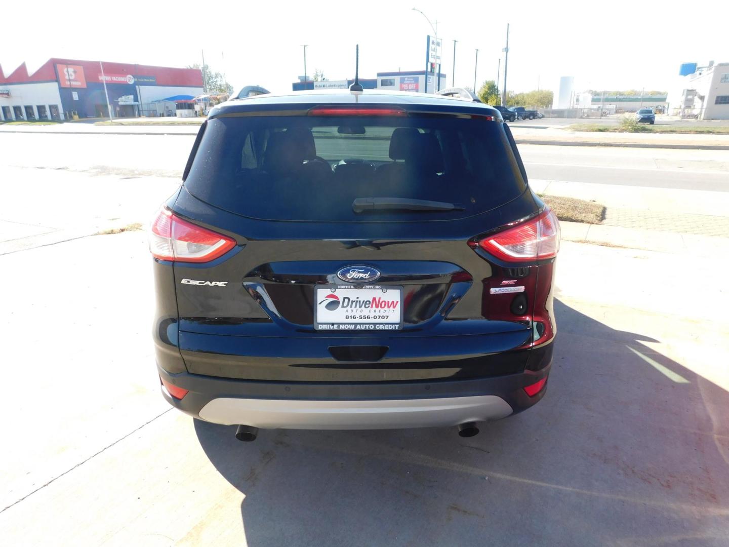 2016 BLACK Ford Escape SE FWD (1FMCU0GX2GU) with an 1.6L L4 DOHC 16V engine, 6-Speed Automatic transmission, located at 2121 Burlington St, North Kansas City, MO, 64116, (816) 556-0707, 39.144707, -94.581978 - Photo#8