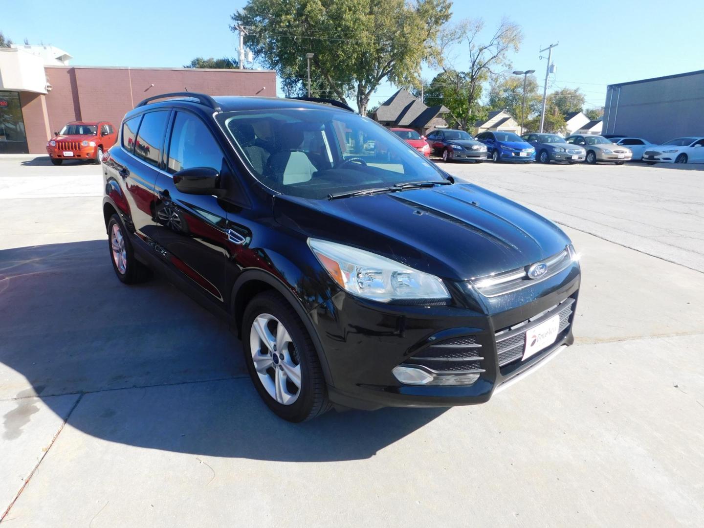 2016 BLACK Ford Escape SE FWD (1FMCU0GX2GU) with an 1.6L L4 DOHC 16V engine, 6-Speed Automatic transmission, located at 2121 Burlington St, North Kansas City, MO, 64116, (816) 556-0707, 39.144707, -94.581978 - Photo#9