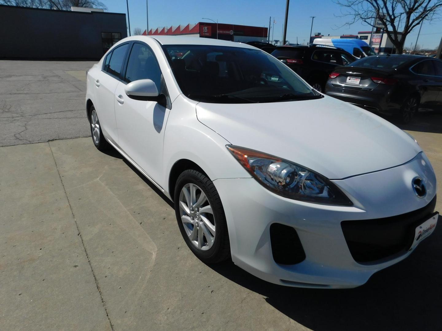 2012 WHITE Mazda MAZDA3 i Touring 4-Door (JM1BL1VF2C1) with an 2.0L L4 DOHC 16V engine, located at 2121 Burlington St, North Kansas City, MO, 64116, (816) 556-0707, 39.144707, -94.581978 - Photo#9