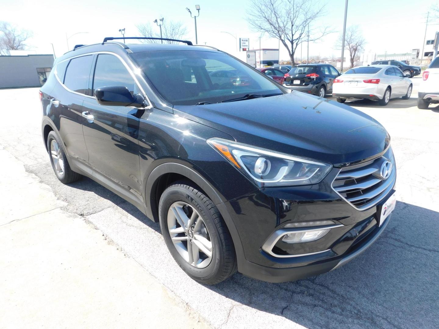 2017 BLACK Hyundai Santa Fe Sport 2.4 FWD (5NMZU3LB2HH) with an 2.4L L4 DOHC 16V engine, 6A transmission, located at 2121 Burlington St, North Kansas City, MO, 64116, (816) 556-0707, 39.144707, -94.581978 - Photo#9
