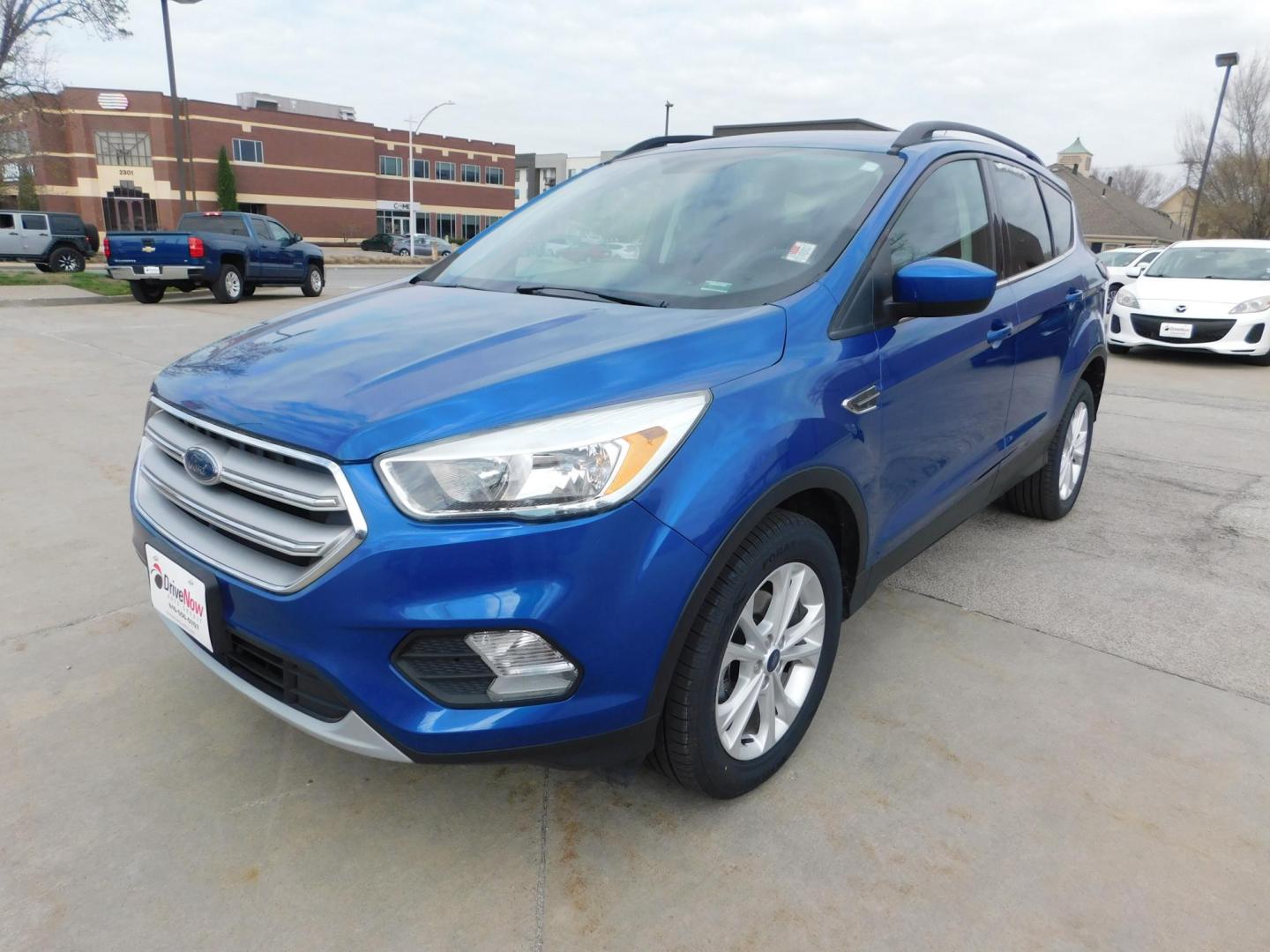 2018 BLUE Ford Escape SE FWD (1FMCU0GD9JU) with an 1.5L L4 DOHC 16V engine, 6A transmission, located at 2121 Burlington St, North Kansas City, MO, 64116, (816) 556-0707, 39.144707, -94.581978 - Photo#0