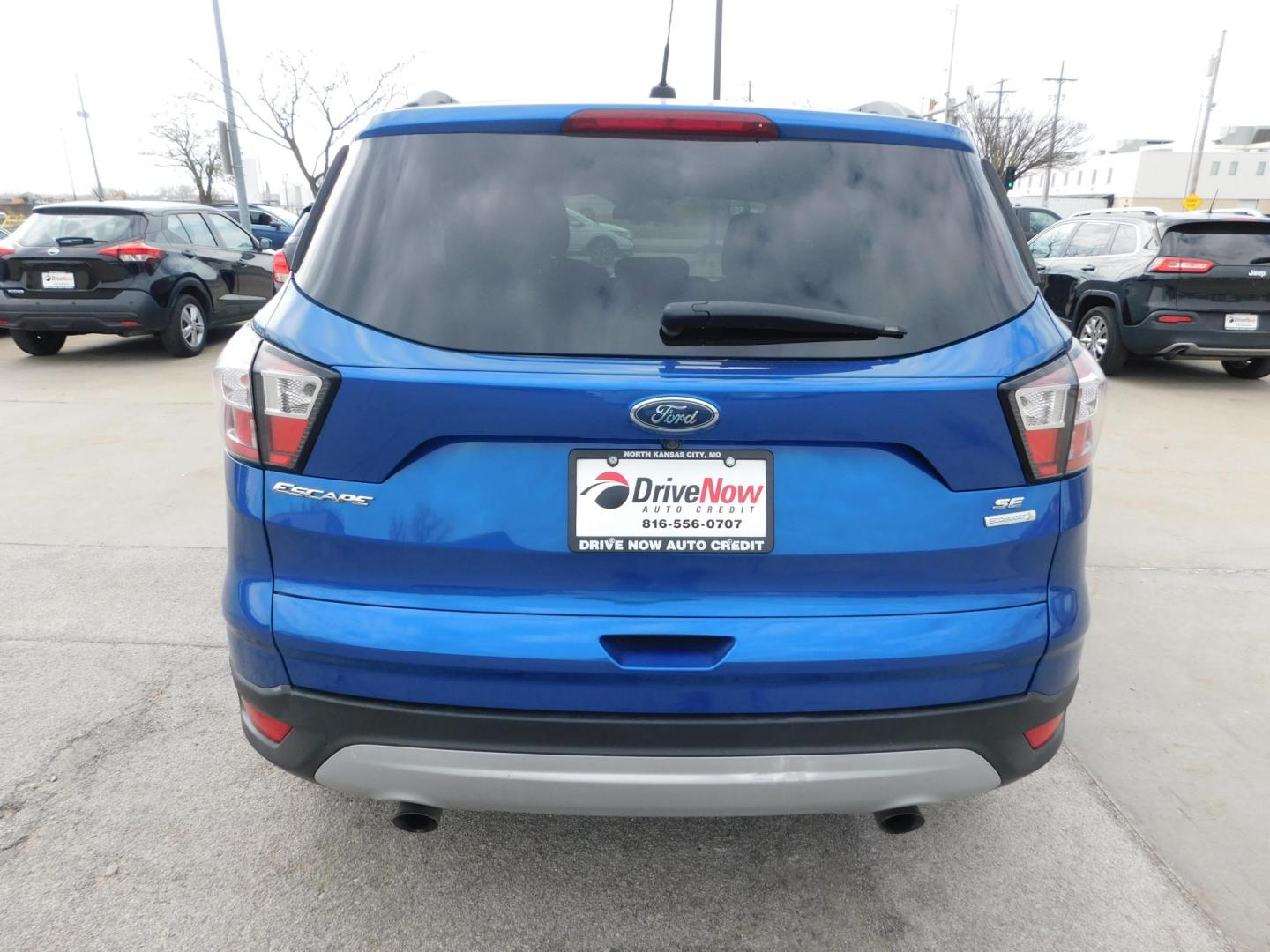 2018 BLUE Ford Escape SE FWD (1FMCU0GD9JU) with an 1.5L L4 DOHC 16V engine, 6A transmission, located at 2121 Burlington St, North Kansas City, MO, 64116, (816) 556-0707, 39.144707, -94.581978 - Photo#8