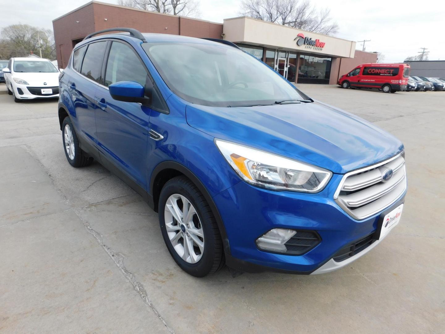 2018 BLUE Ford Escape SE FWD (1FMCU0GD9JU) with an 1.5L L4 DOHC 16V engine, 6A transmission, located at 2121 Burlington St, North Kansas City, MO, 64116, (816) 556-0707, 39.144707, -94.581978 - Photo#9