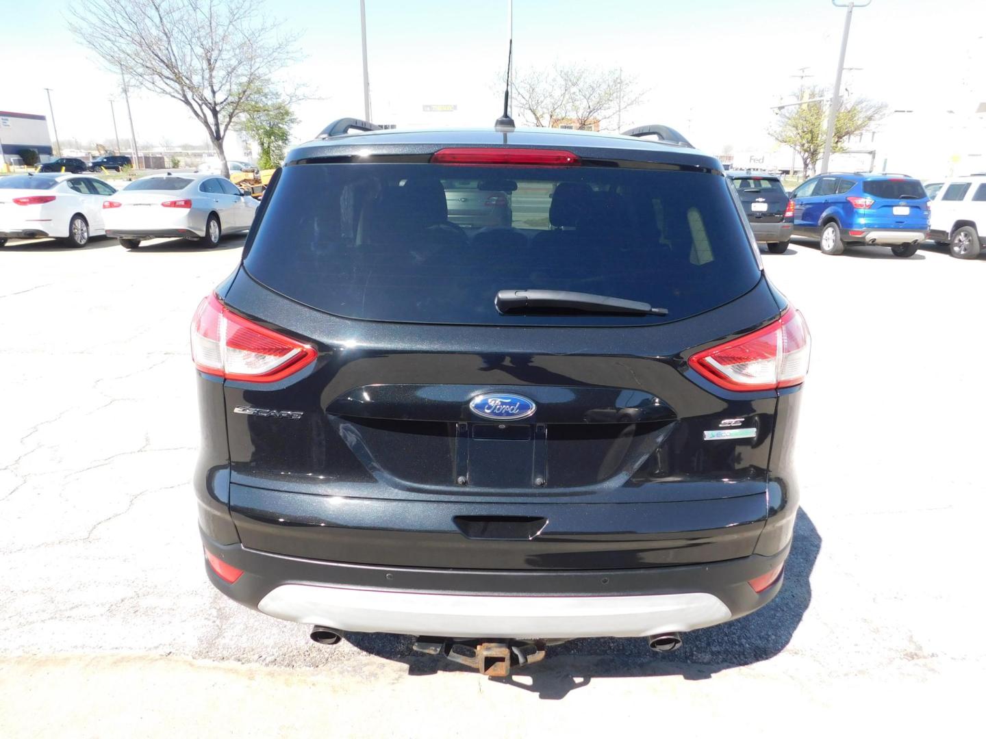 2014 BLACK Ford Escape SE FWD (1FMCU0GX4EU) with an 1.6L L4 DOHC 16V engine, 6-Speed Automatic transmission, located at 2121 Burlington St, North Kansas City, MO, 64116, (816) 556-0707, 39.144707, -94.581978 - Photo#8